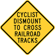 Cyclists Dismount To Cross Railroad Tracks